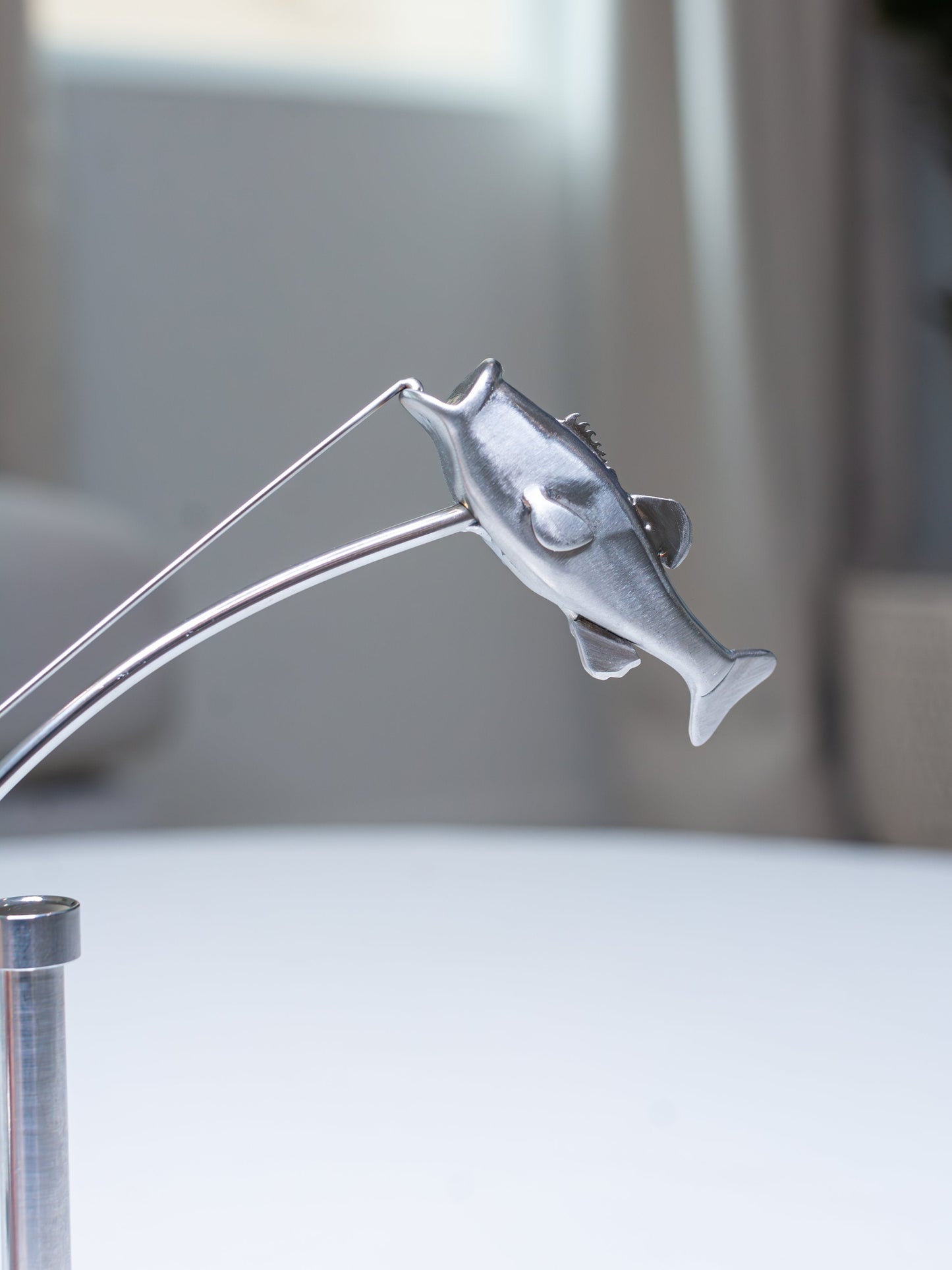 🎣Die balancierende Fischerskulptur