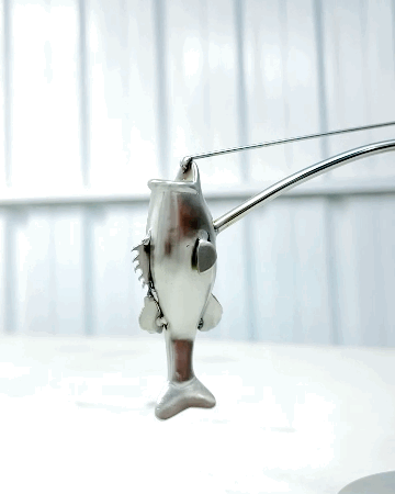 🎣Die balancierende Fischerskulptur